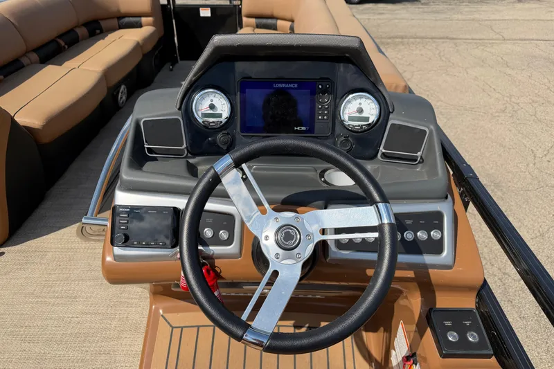 Slide: The Image of Steering console of 2020 Regency 250 LE3 Sport boat with gauges and navigation system. - 15