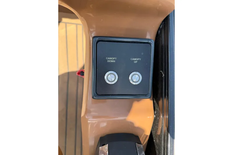 Slide: The Image of Control panel with canopy up and down buttons on 2020 Regency 250 LE3 Sport. - 16