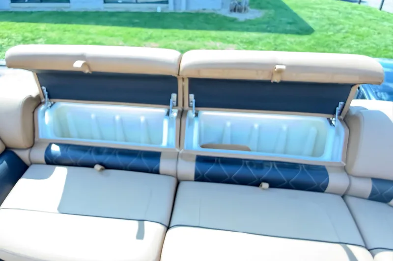 Slide: The Image of 2020 Regency 250 LE3 Sport boat seats with open storage compartments. - 3