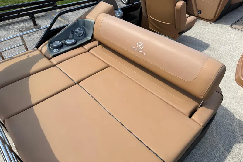 Slide: The Image of Luxurious tan seating on 2020 Regency 250 LE3 Sport boat, featuring sleek design and comfort. - 4