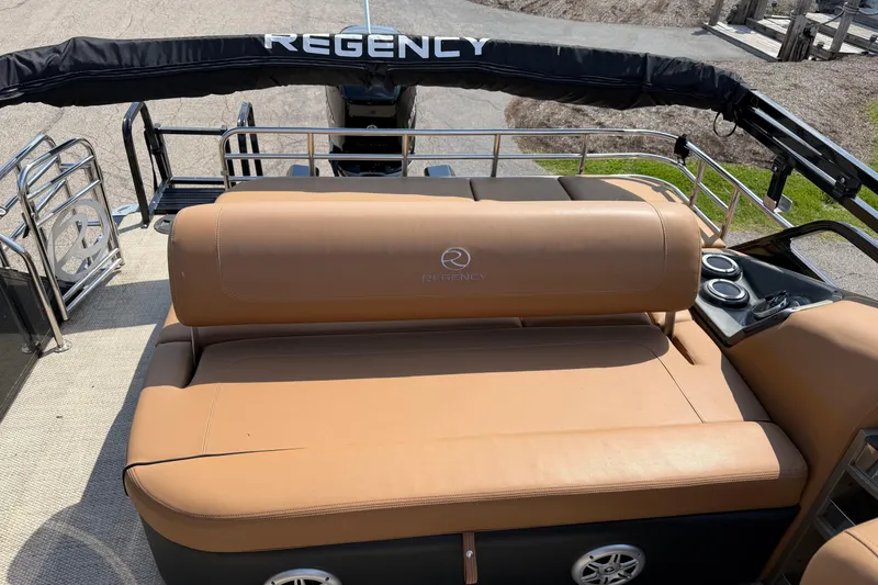 Slide: The Image of 2020 Regency 250 LE3 Sport boat with tan seating and cup holders. - 5