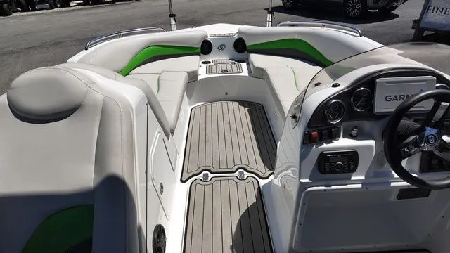 Slide: The Image of Interior of a 2019 Hurricane SS 202 I/O boat with green accents. - 12