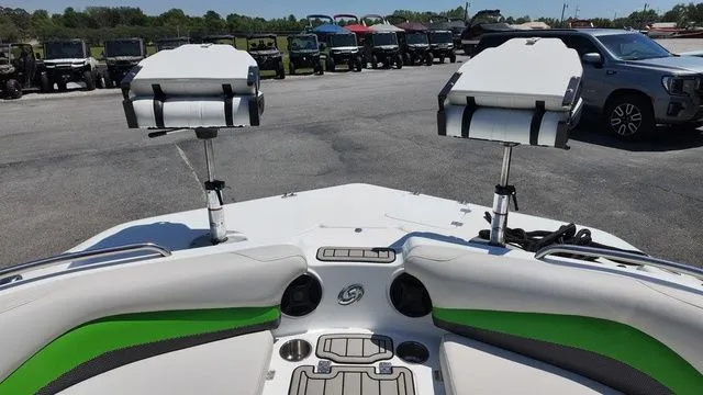 Slide: The Image of Interior view of a 2019 Hurricane SS 202 I/O boat with green accents. - 13