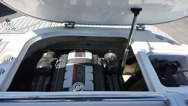 Slide: The Image of Engine compartment of 2019 Hurricane SS 202 I/O boat with open hatch. - 14