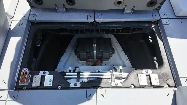 Slide: The Image of 2023 Sea-Doo Switch Sport 21 storage compartment with battery. - 16