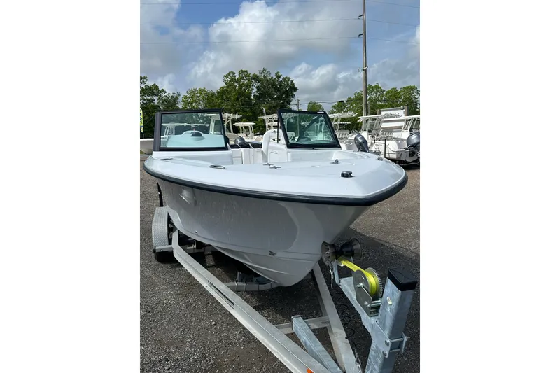 Slide: The Image of 2024 Aquasport 2200 Dual Console boat on trailer, parked outdoors. - 10