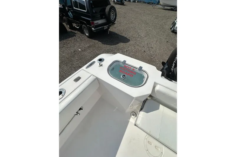 Slide: The Image of 2024 Aquasport 2200 Dual Console boat interior with storage compartment. - 21