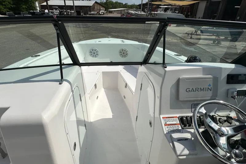 Slide: The Image of 2024 Aquasport 2200 Dual Console boat interior with Garmin navigation system. - 41