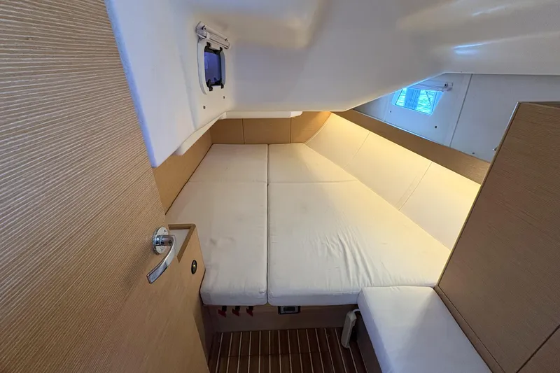 Slide: The Image of Interior cabin of 2018 Elan Impression yacht with cozy bed and wooden accents. - 10
