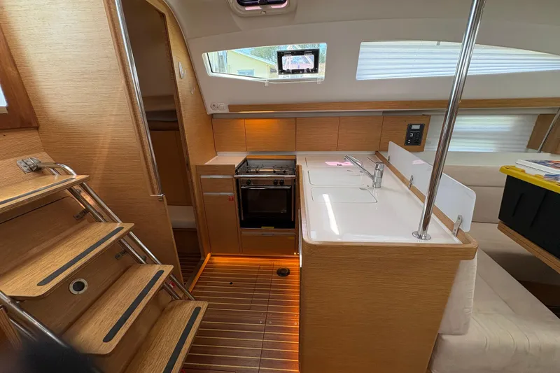Slide: The Image of Modern 2018 Elan Impression yacht interior with sleek kitchen and wooden finishes. - 12