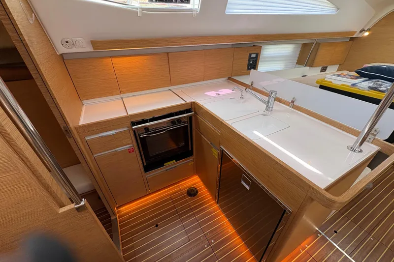 Slide: The Image of Modern kitchen interior of 2018 Elan Impression yacht with wood finish and sleek appliances. - 13