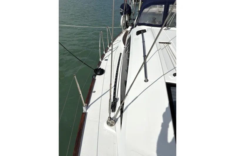 Slide: The Image of 2018 Elan Impression yacht deck with railing and water view. - 2