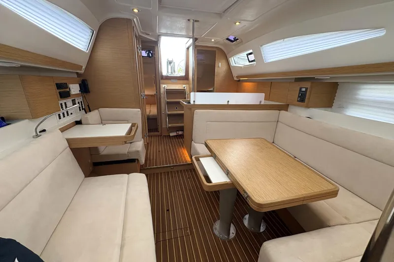 Slide: The Image of 2018 Elan Impression yacht interior with modern wood finish and comfortable seating. - 23