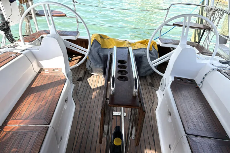 Slide: The Image of Cockpit of a 2018 Elan Impression yacht with dual steering wheels. - 7