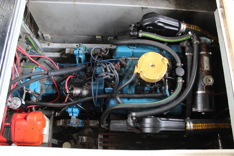 Slide: The Image of Engine compartment of a 1980 Carver 280 Voyager boat, showcasing mechanical components. - 10