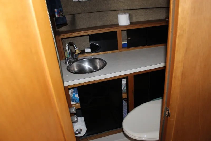 Slide: The Image of Bathroom interior of 1980 Carver 280 Voyager boat with sink and toilet. - 20
