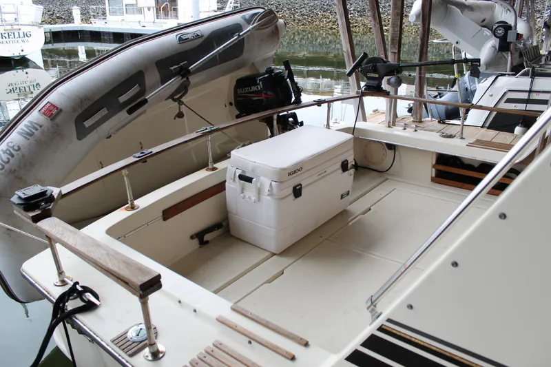 Slide: The Image of 1980 Carver 280 Voyager boat deck with cooler and inflatable dinghy. - 5