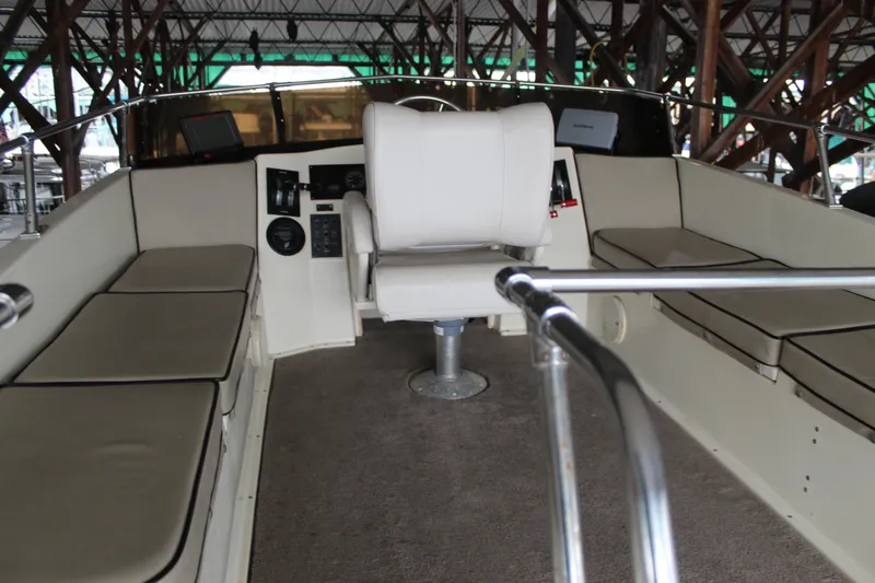 Slide: The Image of Interior view of 1980 Carver 280 Voyager boat with seating and helm. - 6