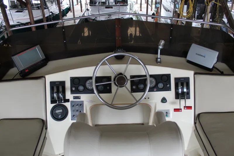 Slide: The Image of Cockpit of 1980 Carver 280 Voyager with steering wheel and navigation equipment. - 7