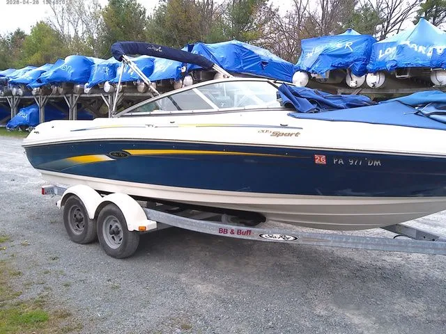 The Image of 2007 Sea Ray 205 boat parked on trailer outdoors. - 1