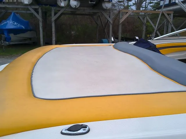 Slide: The Image of Rear view of a 2007 Sea Ray 205 boat with yellow upholstery. - 3