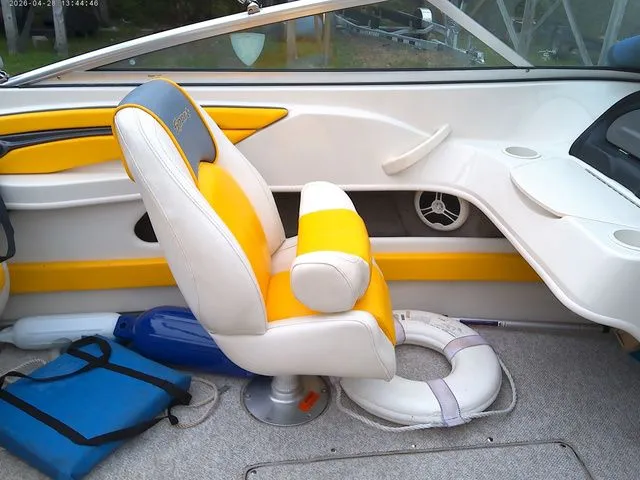 Slide: The Image of Interior of a 2007 Sea Ray 205 boat with yellow accents. - 6