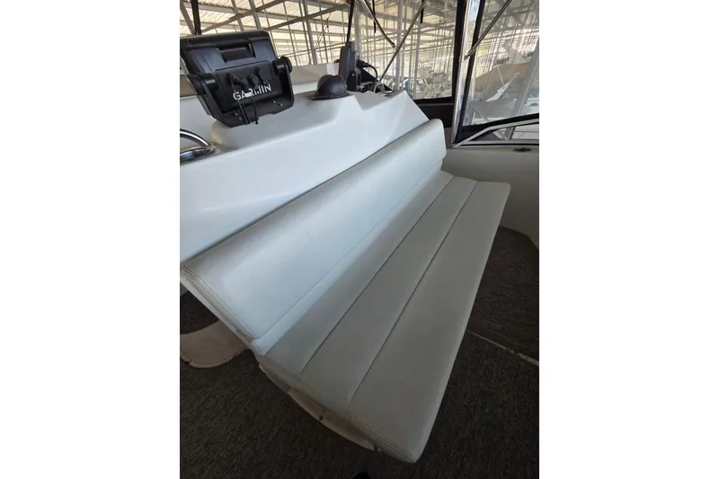 Slide: The Image of 1998 Silverton 372 Motor Yacht helm seat with Garmin navigation system. - 10