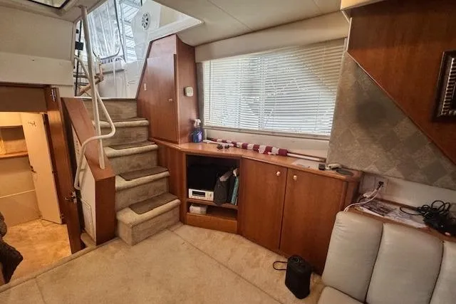 Slide: The Image of Interior of 1998 Silverton 372 Motor Yacht with stairs and wooden cabinetry. - 14
