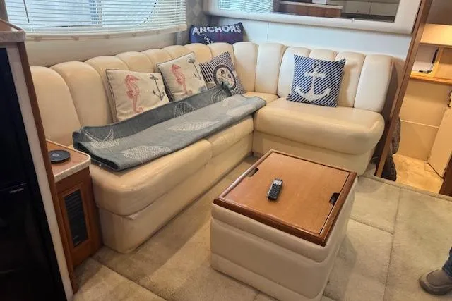 Slide: The Image of Luxurious interior of 1998 Silverton 372 Motor Yacht with plush seating and nautical decor. - 19