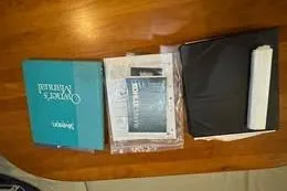 Slide: The Image of Manuals and documents for 1998 Silverton 372 Motor Yacht on wooden table. - 20