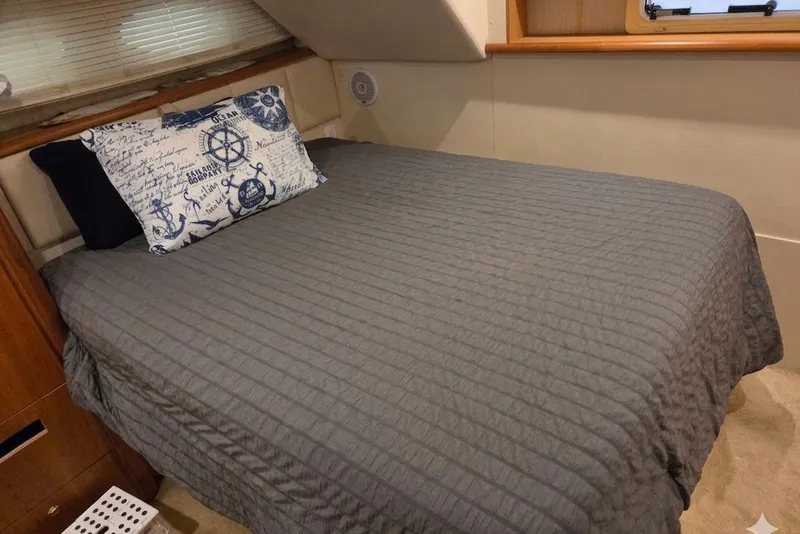 Slide: The Image of Cozy bedroom in 1998 Silverton 372 Motor Yacht with nautical-themed pillow. - 29