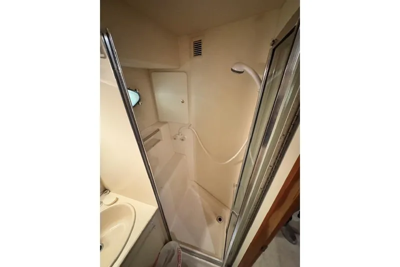 Slide: The Image of 1998 Silverton 372 Motor Yacht bathroom with shower and sink. - 36