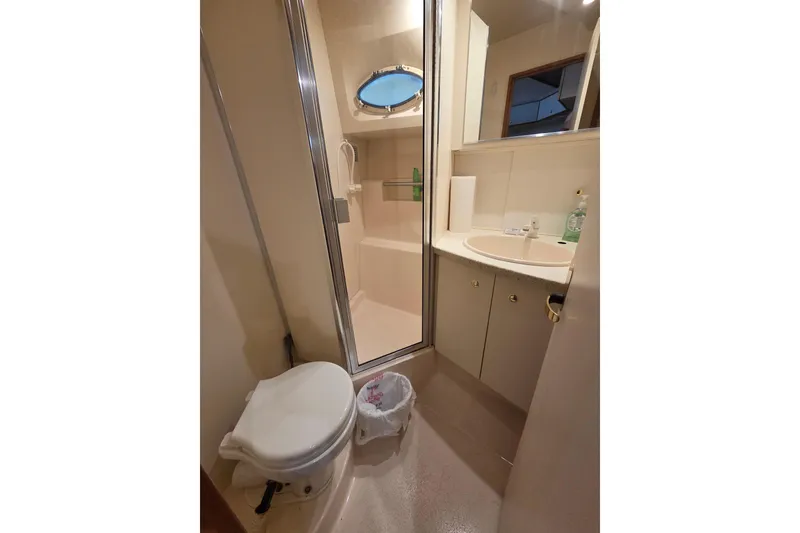 Slide: The Image of Bathroom interior of 1998 Silverton 372 Motor Yacht with shower and sink. - 37