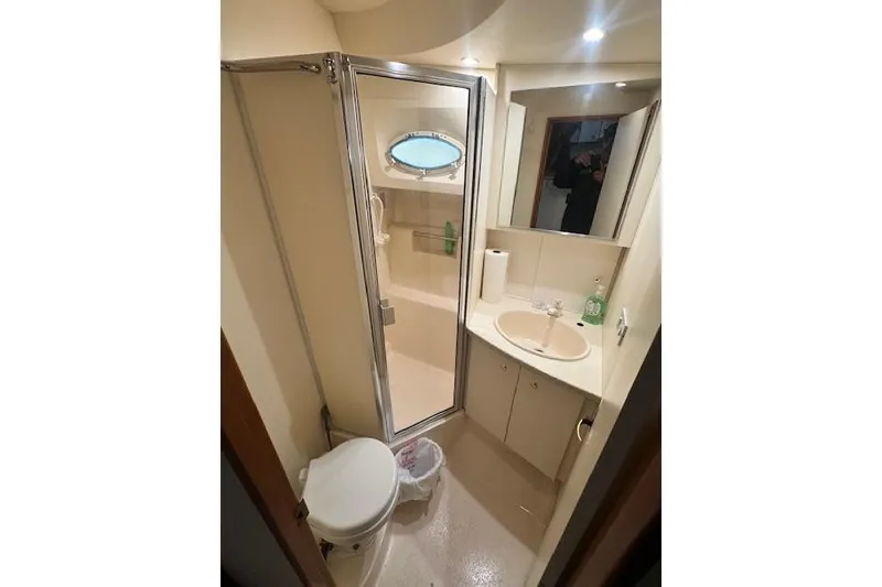 Slide: The Image of Bathroom interior of 1998 Silverton 372 Motor Yacht with shower and sink. - 38