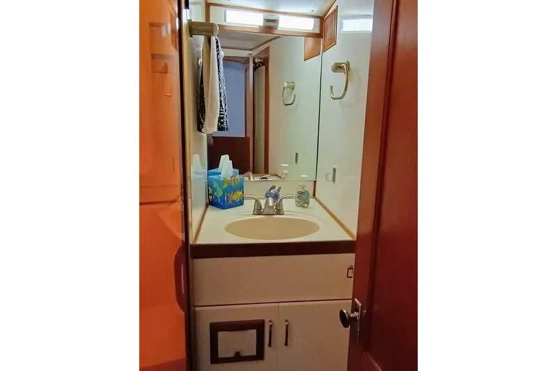 Slide: The Image of Forward bathroom vanity in 1988 Vantare 46' Aft Cabin Wide Body MY yacht. - 23