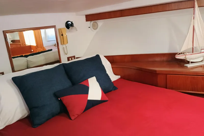 Slide: The Image of Cozy cabin interior of 1988 Vantare 46' Aft Cabin Wide Body MY with nautical decor. - 28
