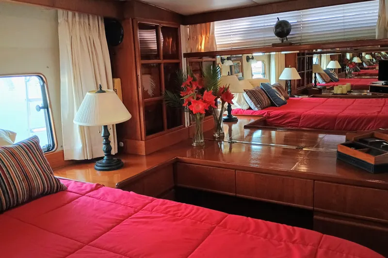Slide: The Image of Luxurious 1988 Vantare 46' Aft Cabin interior with red bedding and elegant decor. - 34