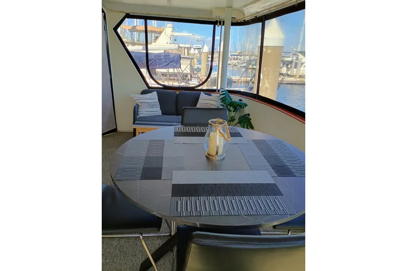 Slide: The Image of Interior of 1988 Vantare 46' Aft Cabin yacht with table and seating area. - 41