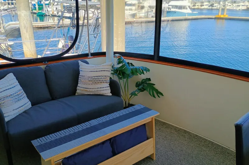 Slide: The Image of Interior of 1988 Vantare 46' Aft Cabin yacht with marina view. - 46