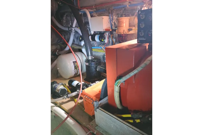Slide: The Image of Engine room of 1988 Vantare 46' Aft Cabin Wide Body MY with mechanical components. - 55