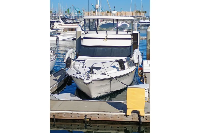 Slide: The Image of 1988 Vantare 46' Aft Cabin Wide Body MY docked at marina. - 66
