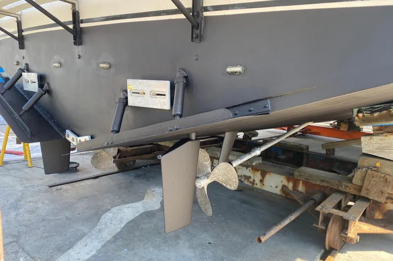 Slide: The Image of 1988 Vantare 46' Aft Cabin Wide Body MY boat hull and propeller in dry dock. - 71