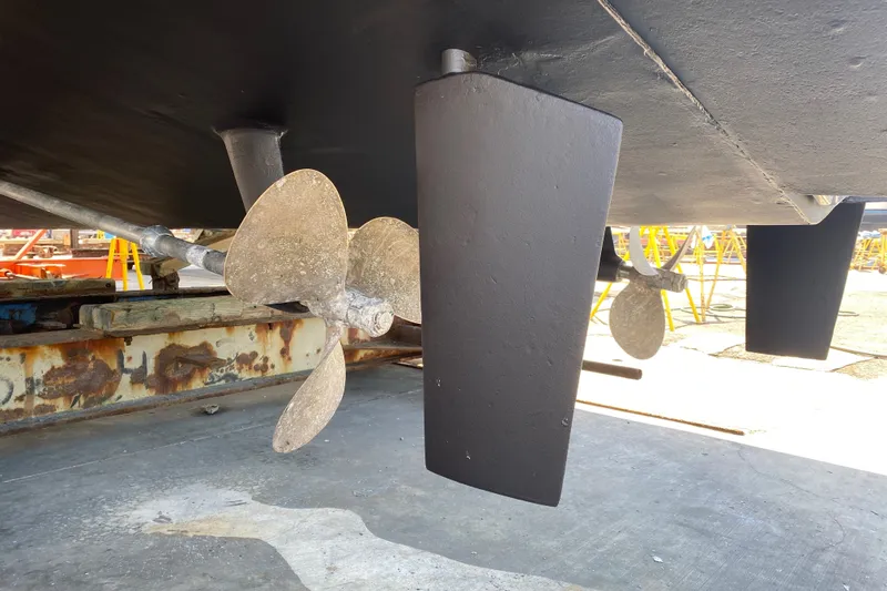 Slide: The Image of 1988 Vantare 46' Aft Cabin Wide Body MY propeller and rudder detail in dry dock. - 68