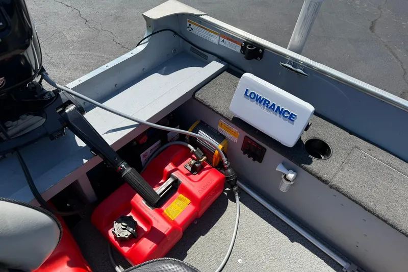 Slide: The Image of Interior of a 2013 Lund 1600 Fury Tiller boat with Lowrance equipment. - 12