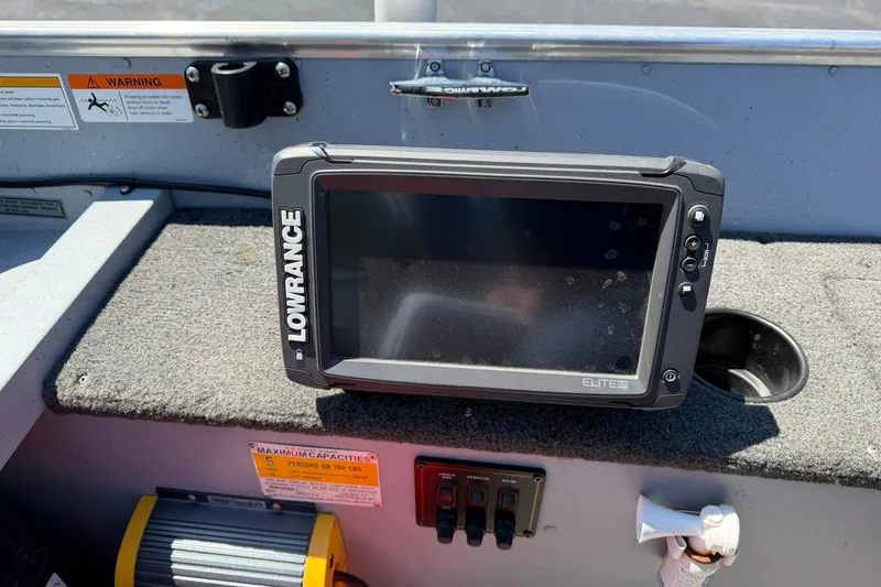 Slide: The Image of Lowrance Elite fish finder on 2013 Lund 1600 Fury Tiller boat dashboard. - 13