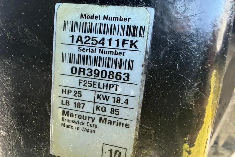Slide: The Image of Label on Mercury Marine engine, model F25ELHPT, showing specifications and serial number. - 21