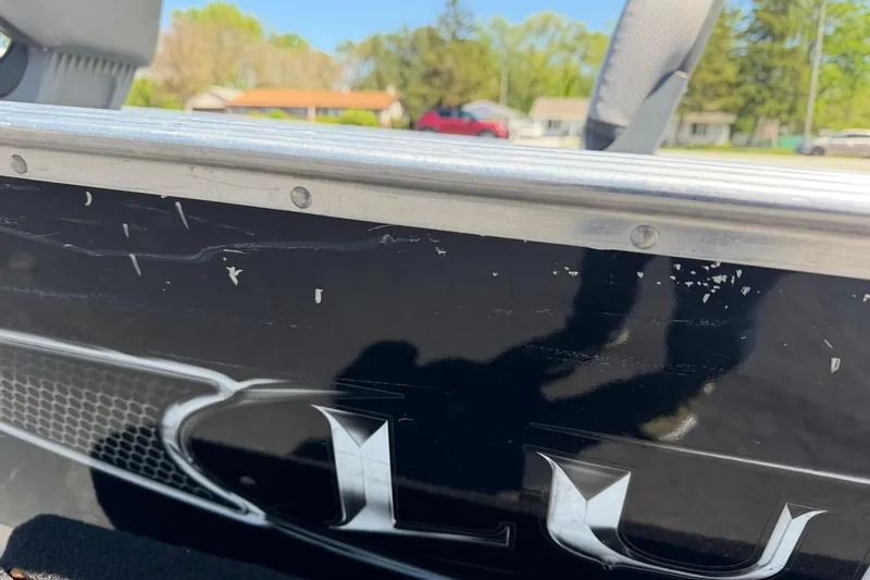 Slide: The Image of 2013 Lund 1600 Fury Tiller boat with visible wear on the side panel. - 22