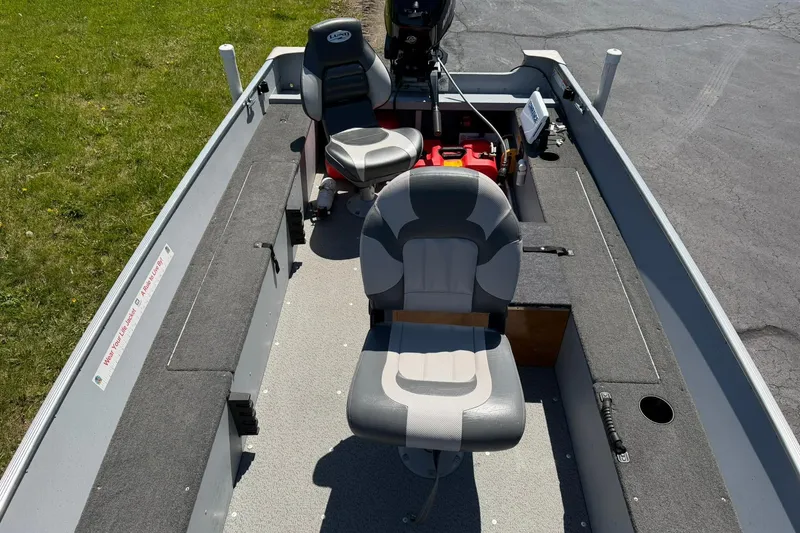 Slide: The Image of 2013 Lund 1600 Fury Tiller boat interior with seating and equipment. - 6
