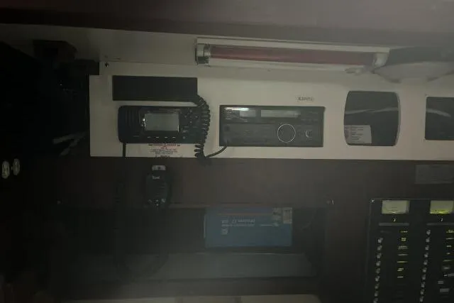 Slide: The Image of Interior of a 1977 Uniflite Valiant 40 yacht with navigation equipment and control panel. - 11