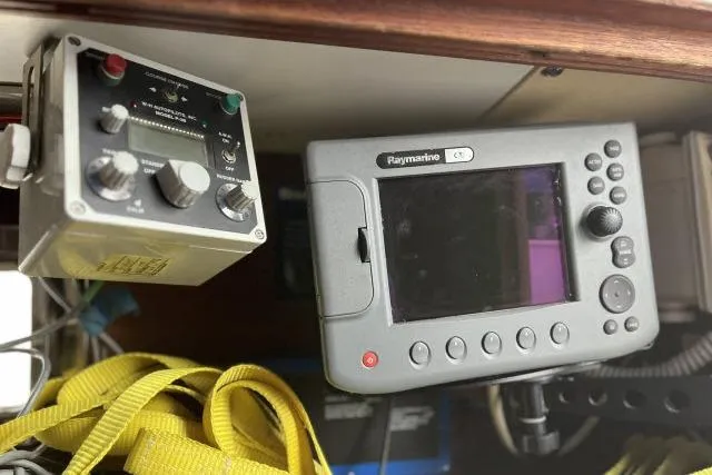 Slide: The Image of Navigation equipment on a 1977 Uniflite Valiant 40 sailboat, featuring Raymarine electronics. - 13